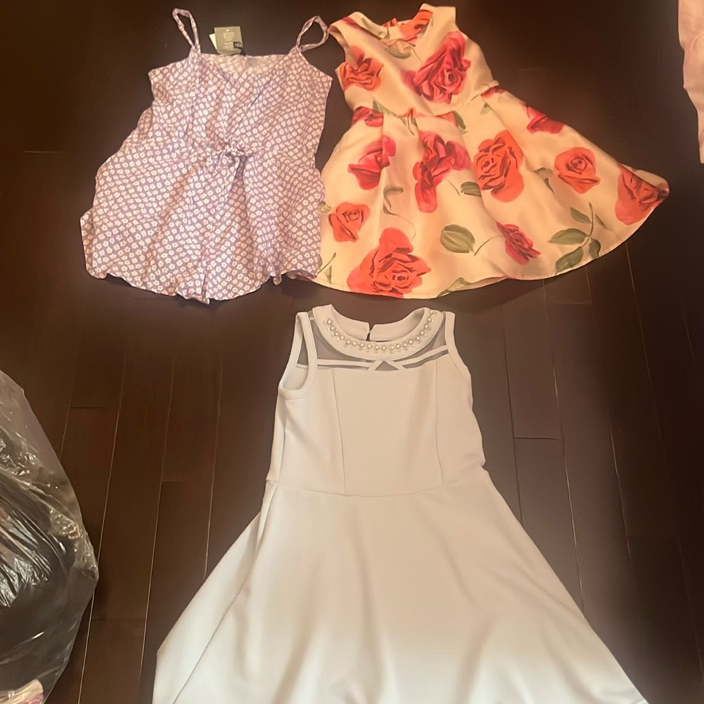 Girls two dresses and a romper never used